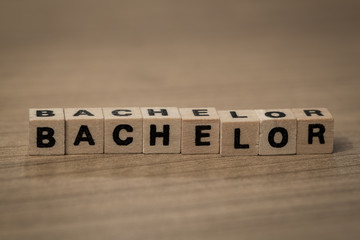 Bachelor in wooden cubes