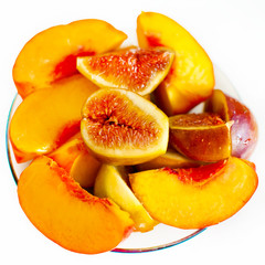 Studio shot of fresh fig fruits and fresh peaches