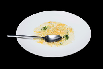 Photo vegetables in creamy sauce on a white plate