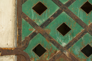 old sheet metal on background of a concrete wall texture