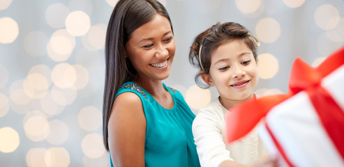 happy mother and child with gift box