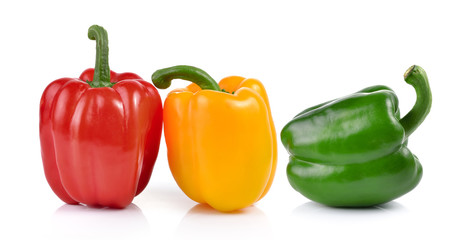 colored peppers over white background