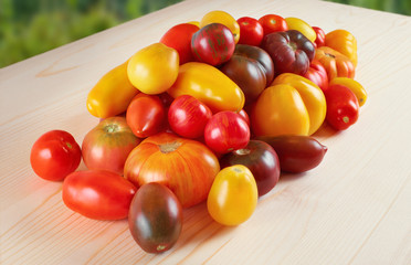 Tomatoes on a wooden table. Selection grade.