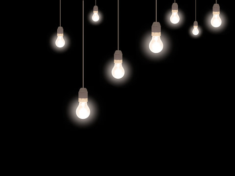 Illumination. Old style frosted light bulbs over black.