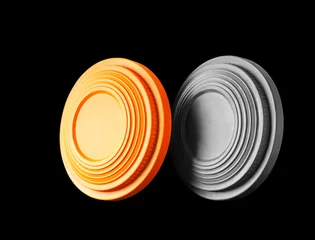 Foto op Canvas Closeup of two clay pigeon targets isolated on a black background. Clipping path inctuded. © Pavel Hlystov