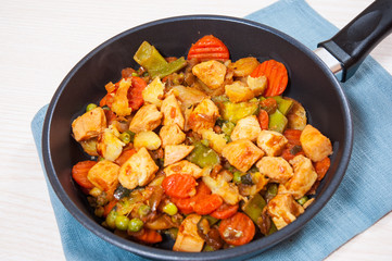 meat stew with mixed vegetables in a frying pan