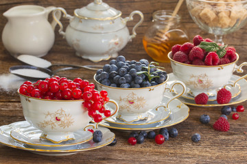 red currant, raspberry and blueberry in cups 