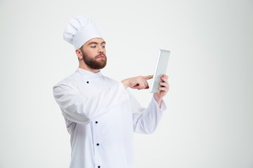 Male chef cook using tablet computer