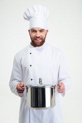 Portrait of a male chef cook holding pan