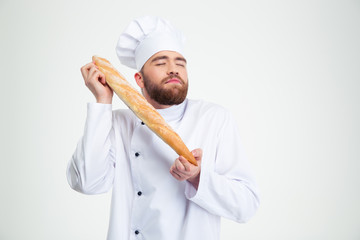 Portrait of male chef cook holding fresh bread