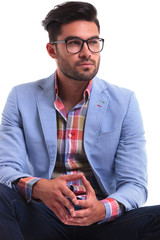 thoughtful young man looking away