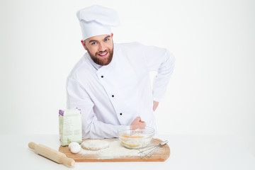 Portrait of a happy male chef cook baking