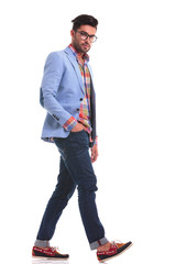 Fototapeta premium casual man looking at the camera while walking