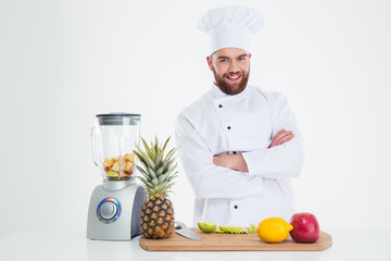 Smiling chef cook standing with arms folded
