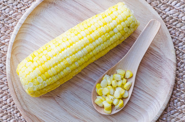 Boiled corn on Wooden Plate