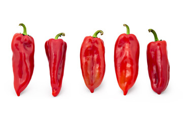 Five fresh sweet red peppers isolated on white background