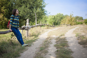 The girl with the backpack traveling alone.