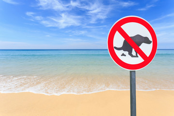No dog pooping sign on the beach