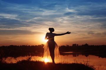 Silhouette of a Ballet Dancer at Sunset Outdoors