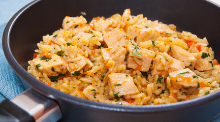 Chicken Breast with Rice and vegetables in a frying pan