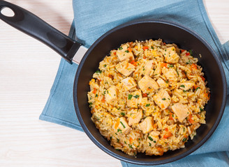 Chicken Breast with Rice and vegetables in a frying pan