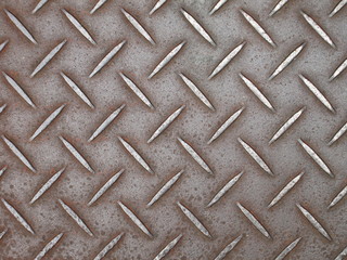 Background of metal diamond plate in brown silver color