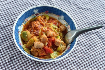 Sweet and sour sauce fried with sausage