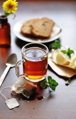 Lemon tea on a wooden background
