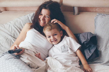 Mom relaxing with her little son