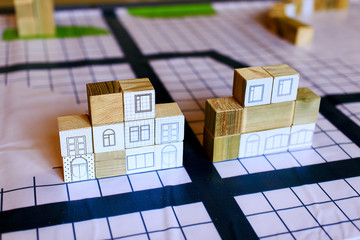 architects planning construction of the city.wooden cubes represent the house on a schematic map of the site of the city