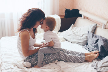 Mom relaxing with her little son