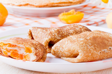 Pancakes with curd cheese and dried apricots