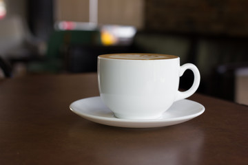 Fototapeta premium Cup of art latte or cappuccino coffee.
