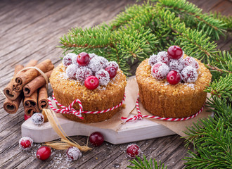Cranberry muffins with powdered sugar and fresh berries