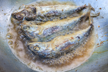 Mackerel fried in a pan