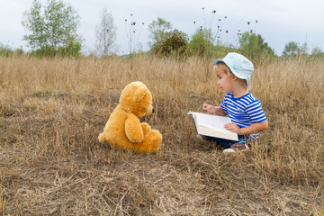 Cute girl reading book Teddy bear - 92533830