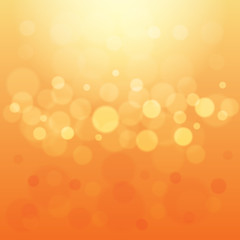 Abstract Light Orange Background with Bokeh Defocused Lights