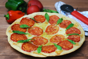 fresh pizza margarita on a wooden plate