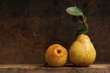 Organic pears on wooden shelf