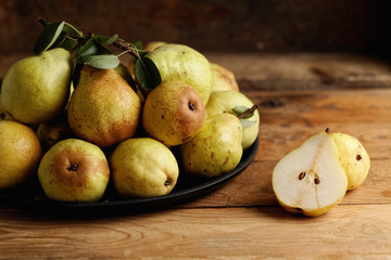 Organic pears on wooden table