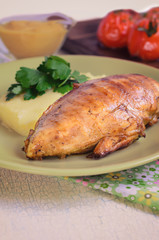 Grilled chicken fillet with mashed potatoes and grilled tomatoes. Rustic style.