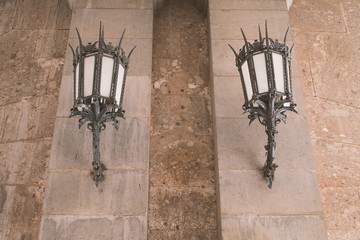 Historical lampposts hung on the wall