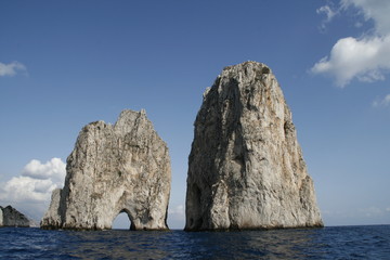 Faraglioni are the three stacks located off the island of Capri in the Bay of Naples.