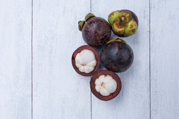 Mangosteen with space on wood background