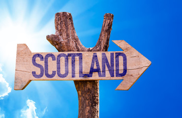 Scotland wooden sign with sky background