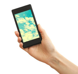 Hand holding mobile smart phone with sky in screen. Cloud computing concept
