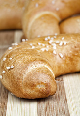 Macro photo of fresh homemade rolls. Studio shot, Photographed on wooden table.