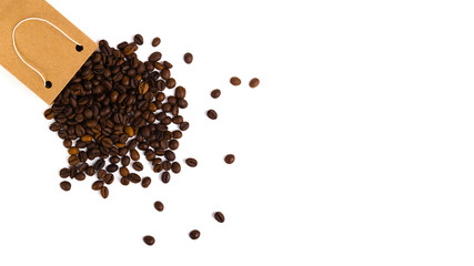 Paper bag with grain coffee on white background