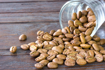 Roasted coffee beans on wooden background