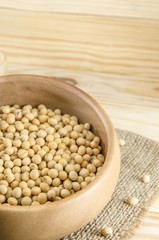 soybean on wooden board and sack